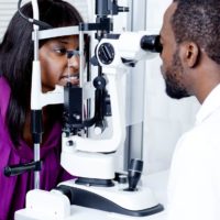 Eye doctor examining a patient