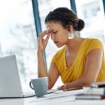 A woman experiencing eyestrain