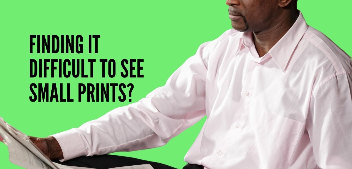 A man having difficulty reading small prints
